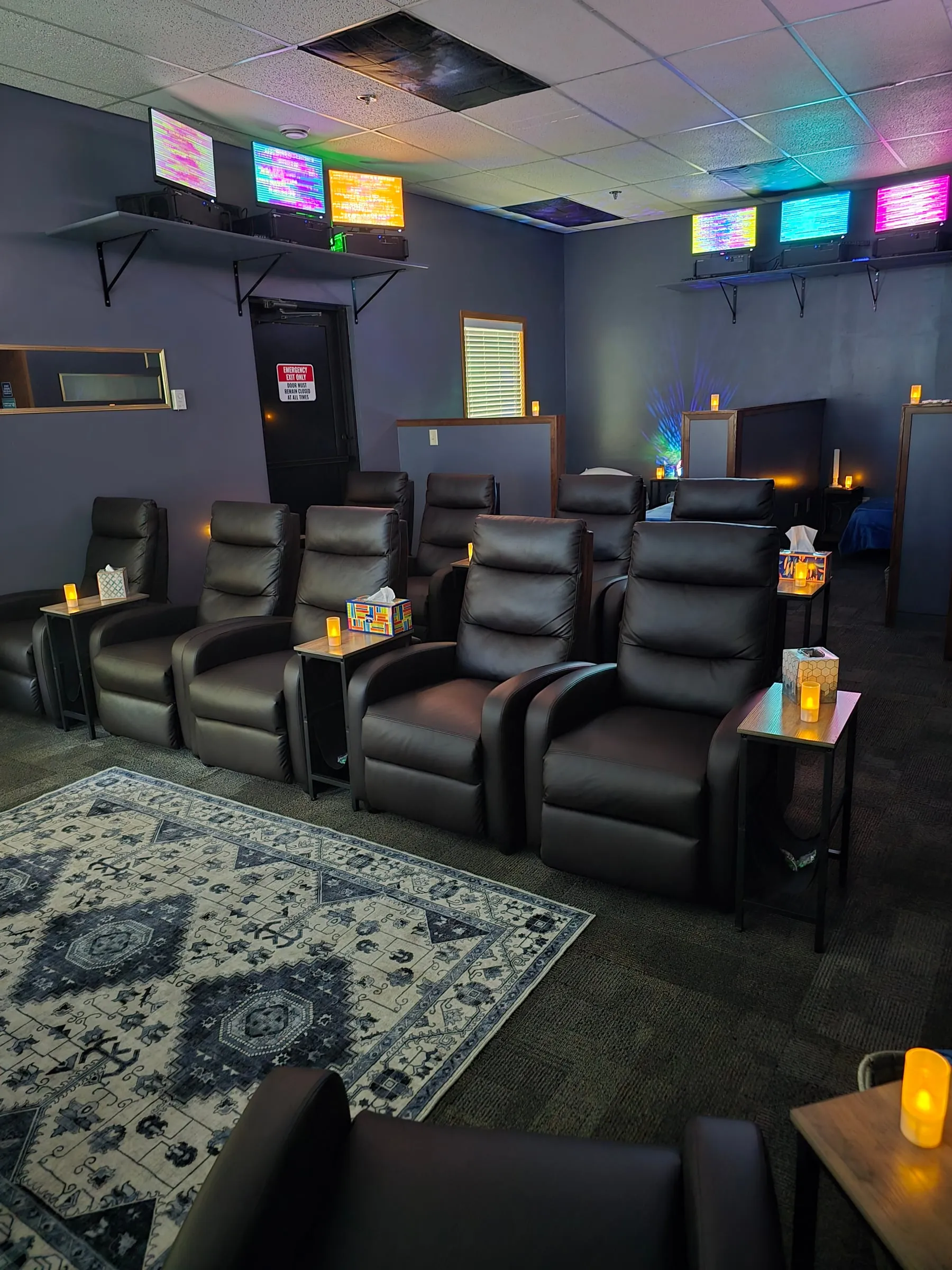 Reclining chairs and a patterned rug in the Energy Enhancement Room
